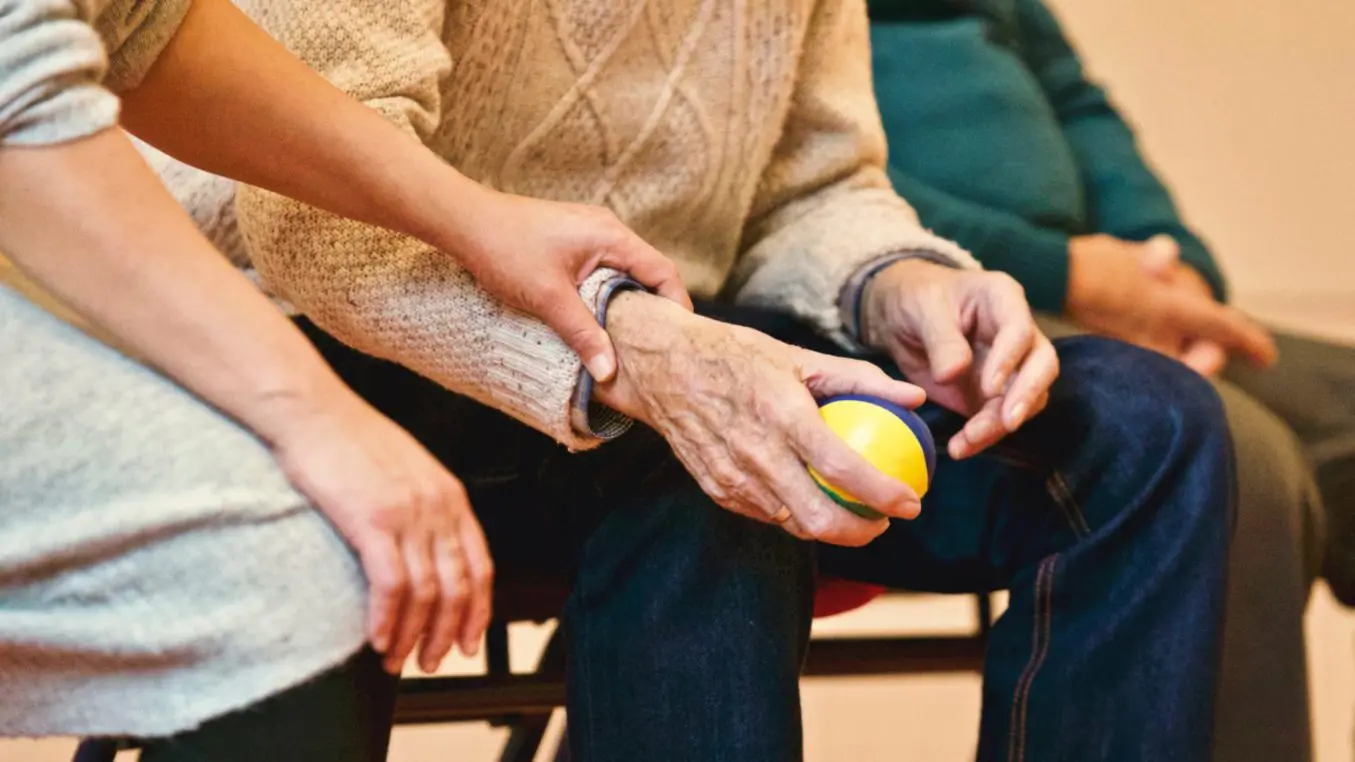 elderly man taking part in an activity