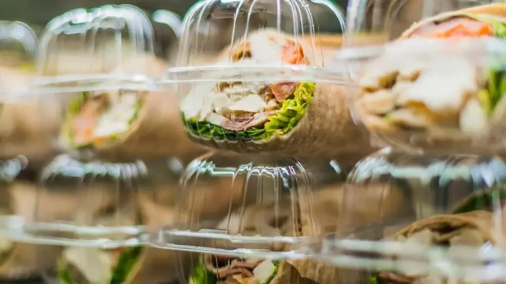 Lots of tortilla wraps in plastic tubs